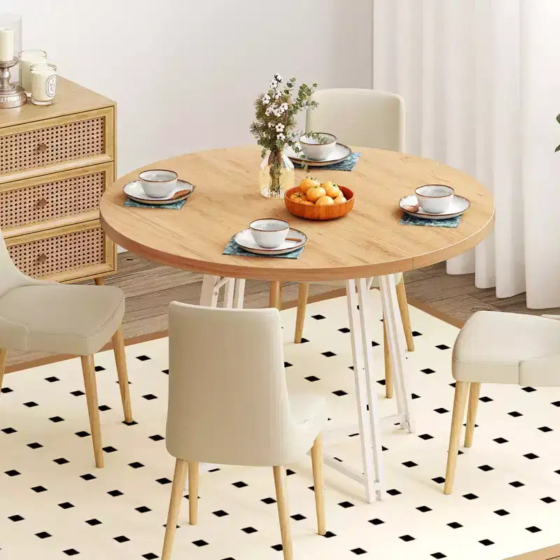 Table à manger avec 8 pieds de support en métal et une base en forme de croix.